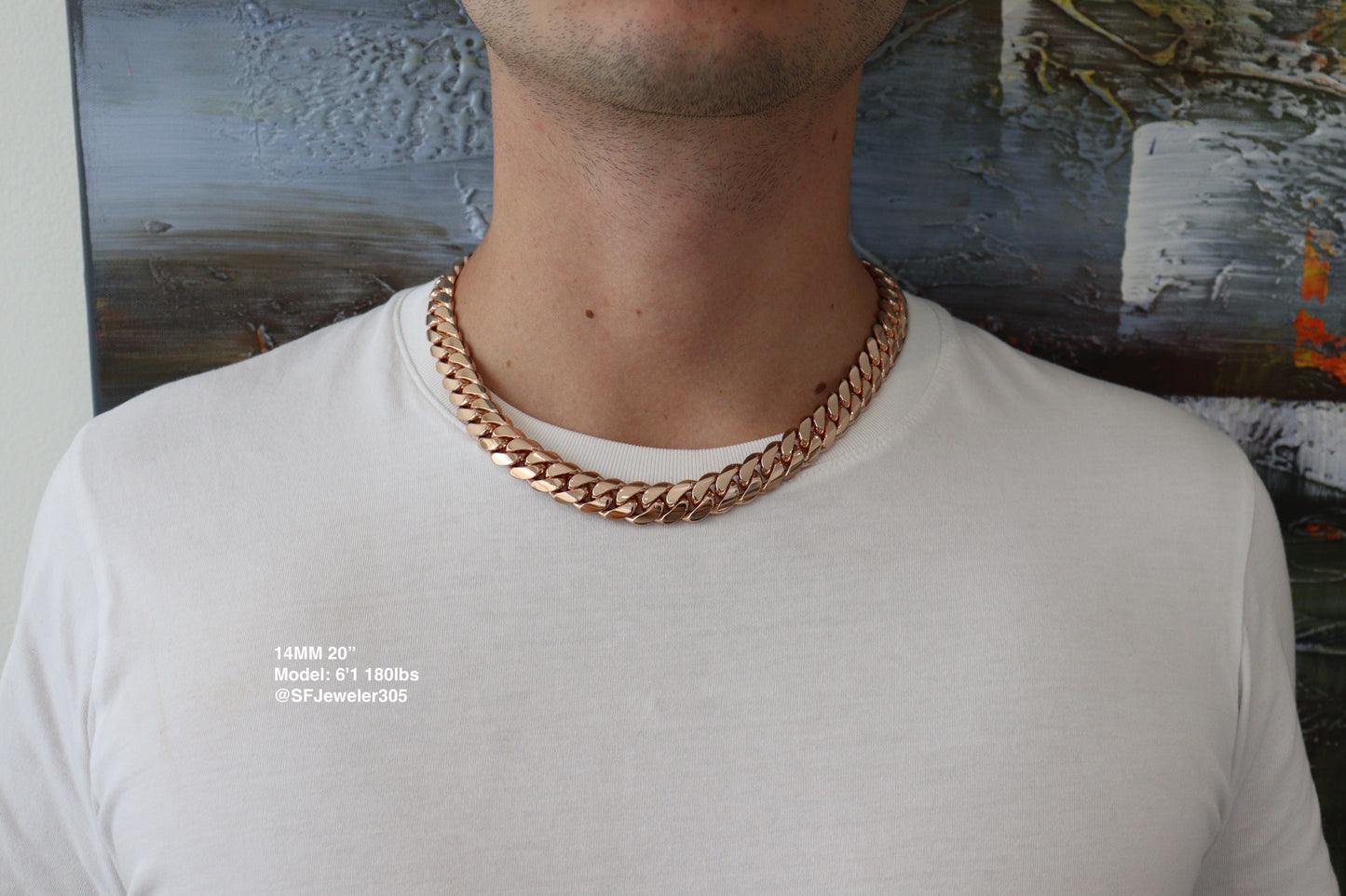 Man wearing a 14MM 20 inch rose gold over silver Cuban link chain, modeled by SF Jeweler 305. The bold Miami Cuban chain has a heavy, polished finish and is styled with a casual t-shirt.