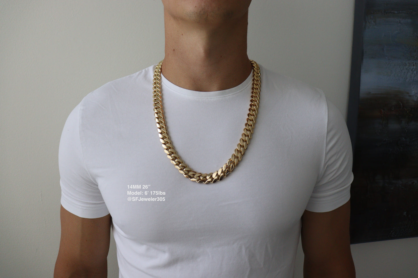 Man wearing a 14MM 26 inch yellow gold over silver Cuban link chain, modeled by SF Jeweler 305. The bold Miami Cuban chain has a heavy, polished finish and is styled with a casual t-shirt.