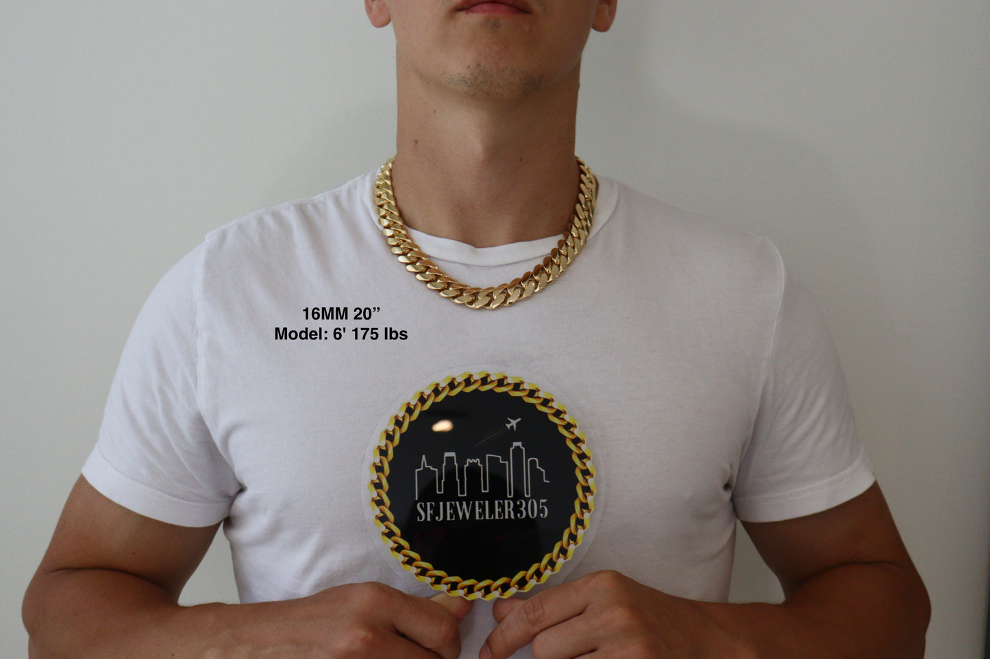 Man wearing a 16MM 20 inch yellow gold over silver Cuban link chain, modeled by SF Jeweler 305. The bold Miami Cuban chain has a heavy, polished finish and is styled with a casual t-shirt.