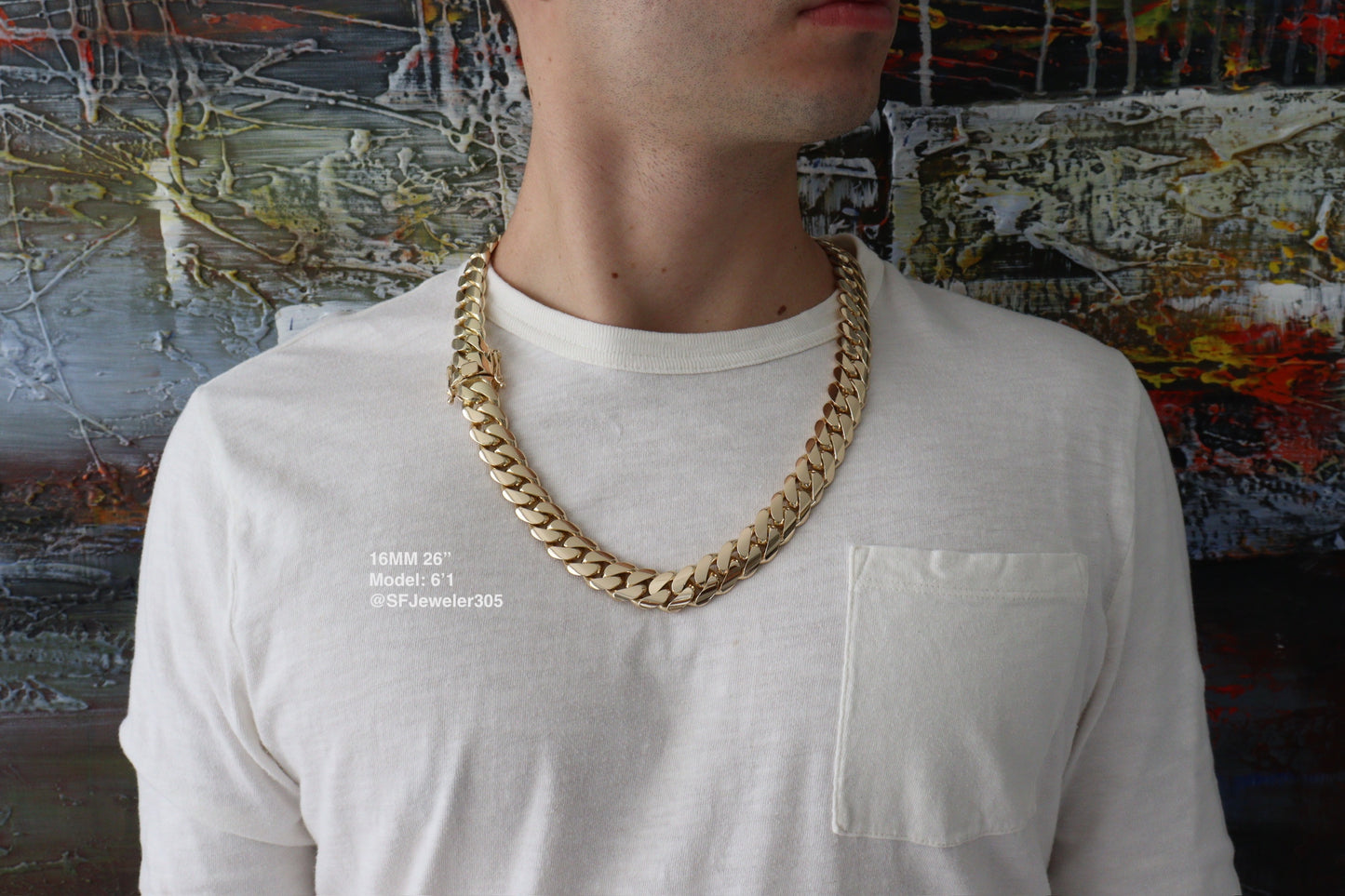 Man wearing a 16MM 26 inch yellow gold over silver Cuban link chain, modeled by SF Jeweler 305. The bold Miami Cuban chain has a heavy, polished finish and is styled with a casual t-shirt.