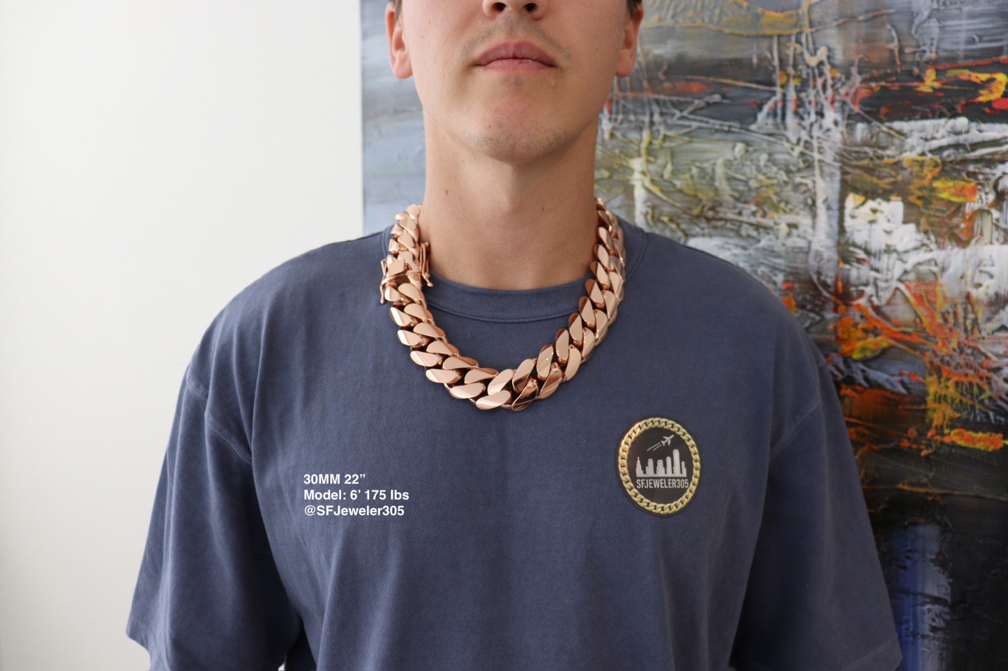 Man wearing a 30MM 22-inch rose gold over silver Cuban link chain, modeled by SF Jeweler 305. The bold Miami Cuban chain has a heavy, polished finish and is styled with a casual t-shirt.