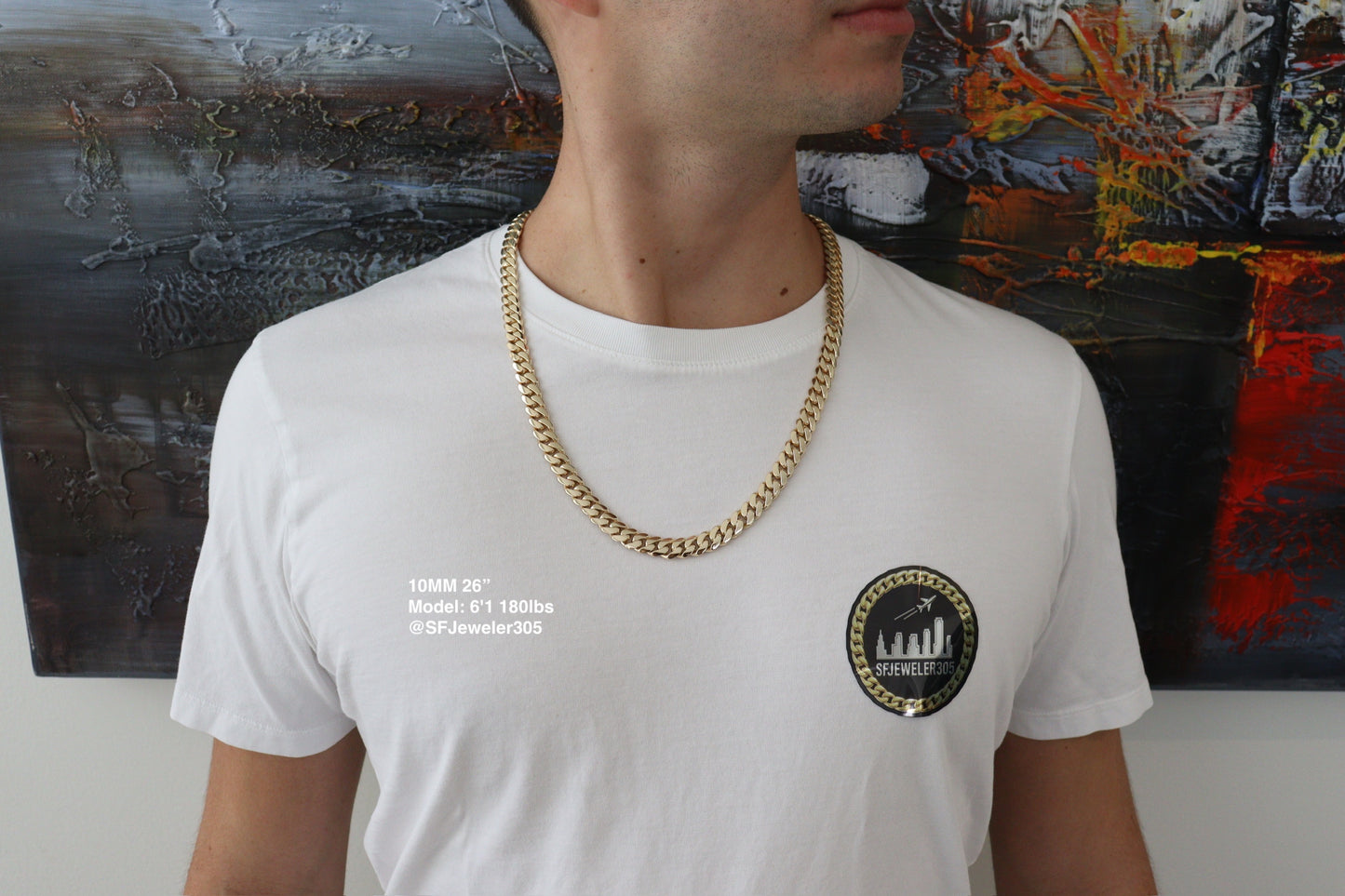 Man wearing a 10MM 26-inch yellow gold over silver Cuban link chain, modeled by SF Jeweler 305. The bold Miami Cuban chain has a heavy, polished finish and is styled with a casual t-shirt.