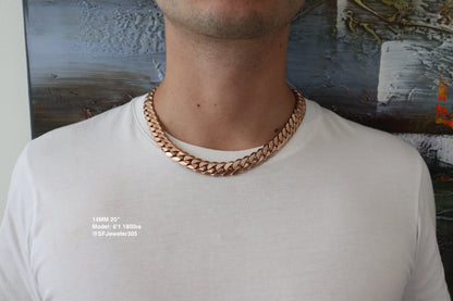 Man wearing a 14MM 20 inch rose gold over silver Cuban link chain, modeled by SF Jeweler 305. The bold Miami Cuban chain has a heavy, polished finish and is styled with a casual t-shirt.