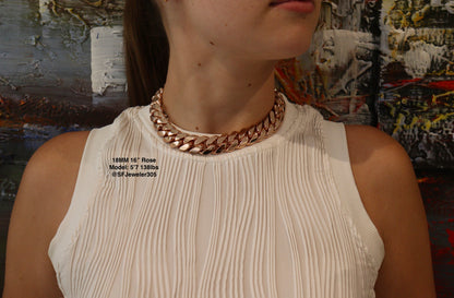 women wearing a 18MM 16-inch Rose gold over silver Cuban link chain, modeled by SF Jeweler 305. The bold Miami Cuban chain has a heavy, polished finish and is styled with a casual t-shirt.