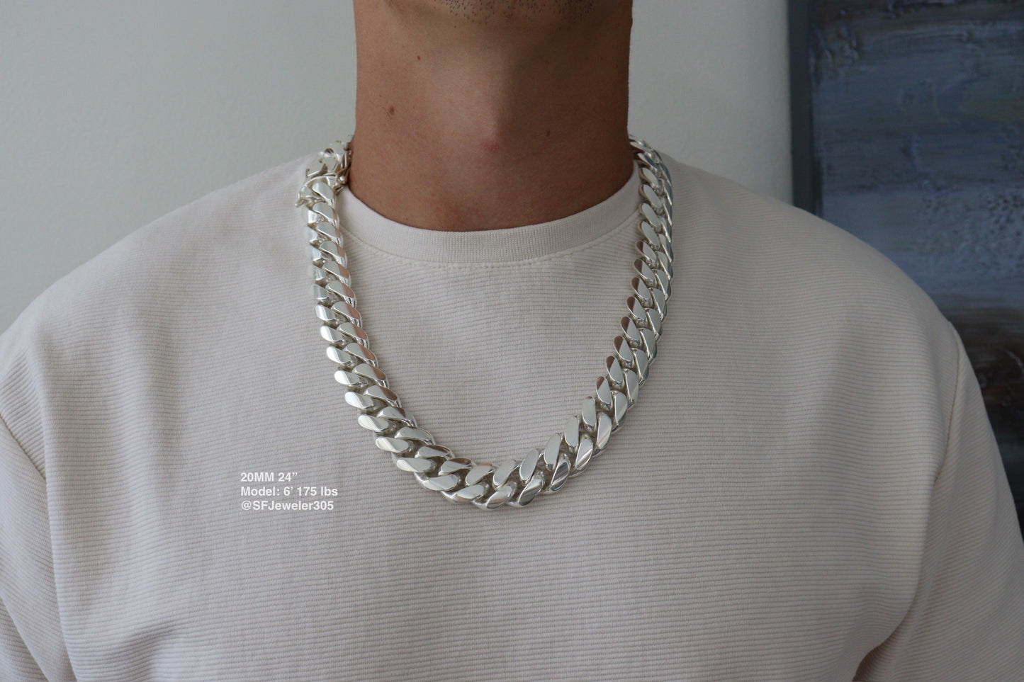 Man wearing a 20MM 24-inch .999 silver Cuban link chain, modeled by SF Jeweler 305. The bold Miami Cuban chain has a heavy, polished finish and is styled with a casual t-shirt.