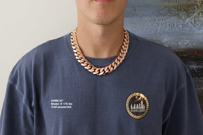 Man wearing a 20MM 20-inch Rose gold over silver Cuban link chain, modeled by SF Jeweler 305. The bold Miami Cuban chain has a heavy, polished finish and is styled with a casual t-shirt.