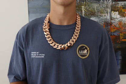 Man wearing a 26MM 26-inch rose gold over silver Cuban link chain, modeled by SF Jeweler 305. The bold Miami Cuban chain has a heavy, polished finish and is styled with a casual t-shirt.