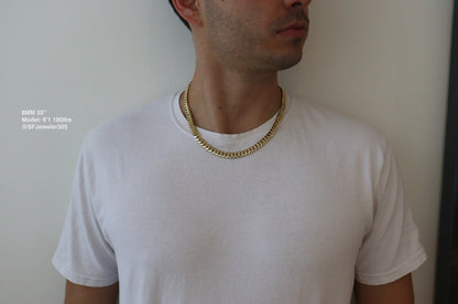 Man wearing a 8MM 22-inch yellow gold over silver Cuban link chain, modeled by SF Jeweler 305. The bold Miami Cuban chain has a heavy, polished finish and is styled with a casual t-shirt.